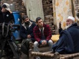 George interviews local Imam, Faisal Muhammed (R), in Kishawra, on 25 February, 2011, in the Swat Valley, Pakistan. The Taliban burnt down his family home, killing his 7 y/o daughter in the process, after her refused to submit to their rule and the townspeople rebelled.